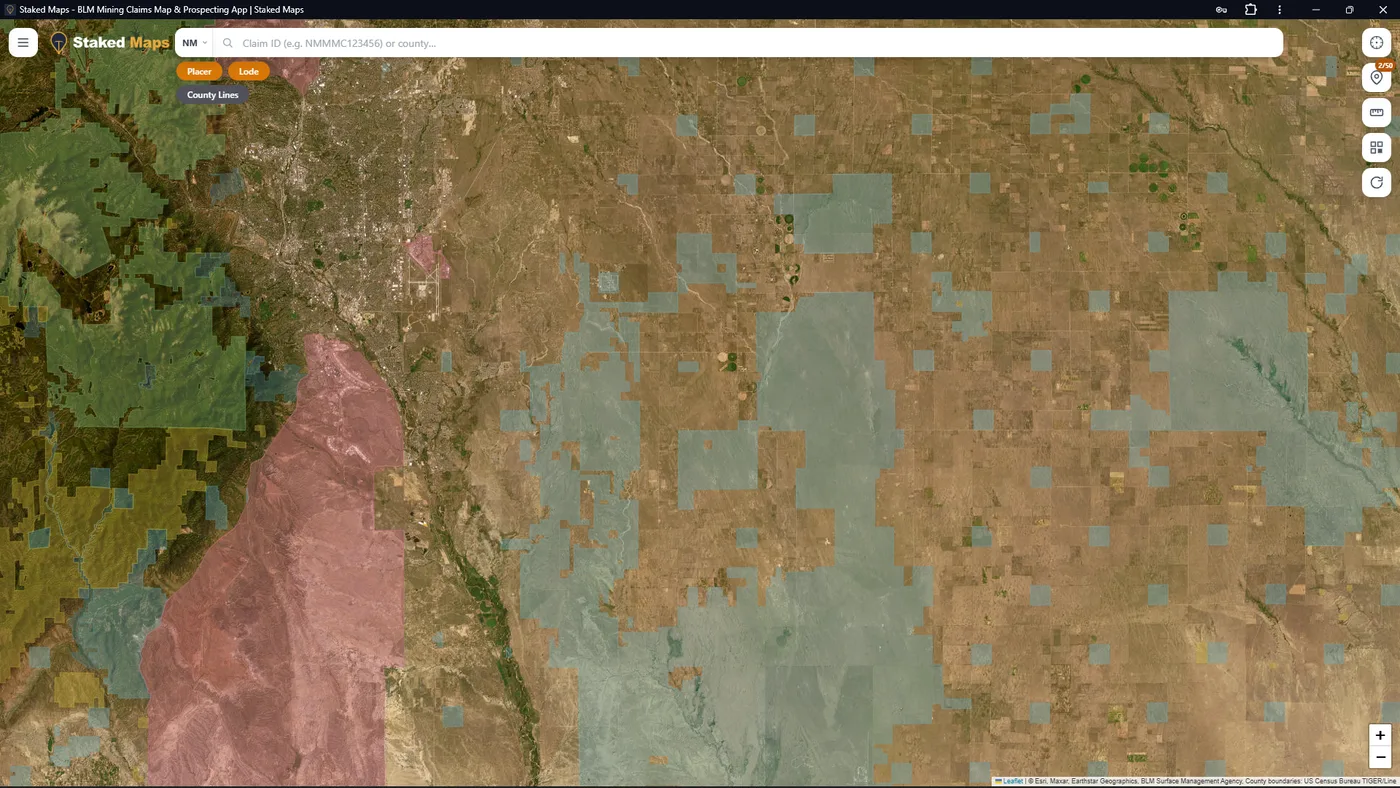 State Trust and private land east of Albuquerque shown in the Staked Maps surface-management layer, with no current mining claims in view